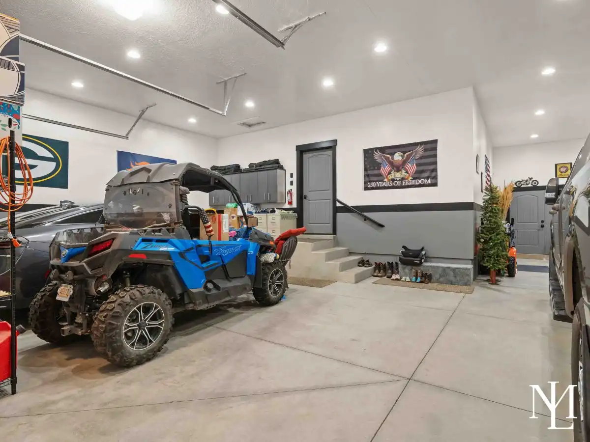 Oversized garage with extra storage space and room for recreational vehicles or gear.