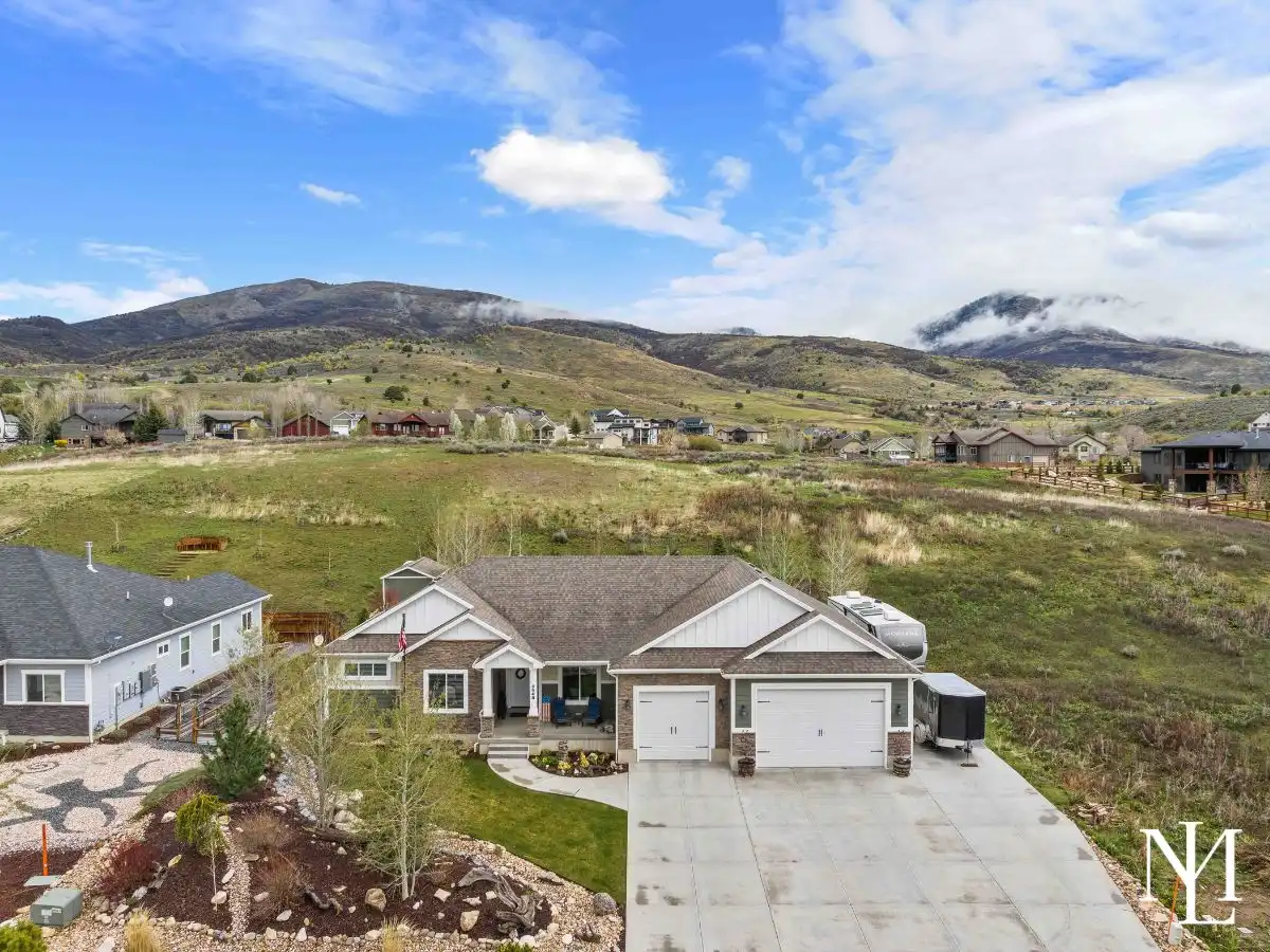 Aerial front view of Eden, Utah home in The Preserve at Sheep Creek with open space and mountain views.