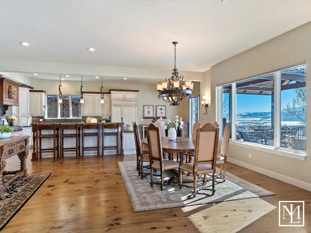 Expansive view of the dining and kitchen areas of the luxury home at 5932 E Big Horn Pkwy in Eden, UT