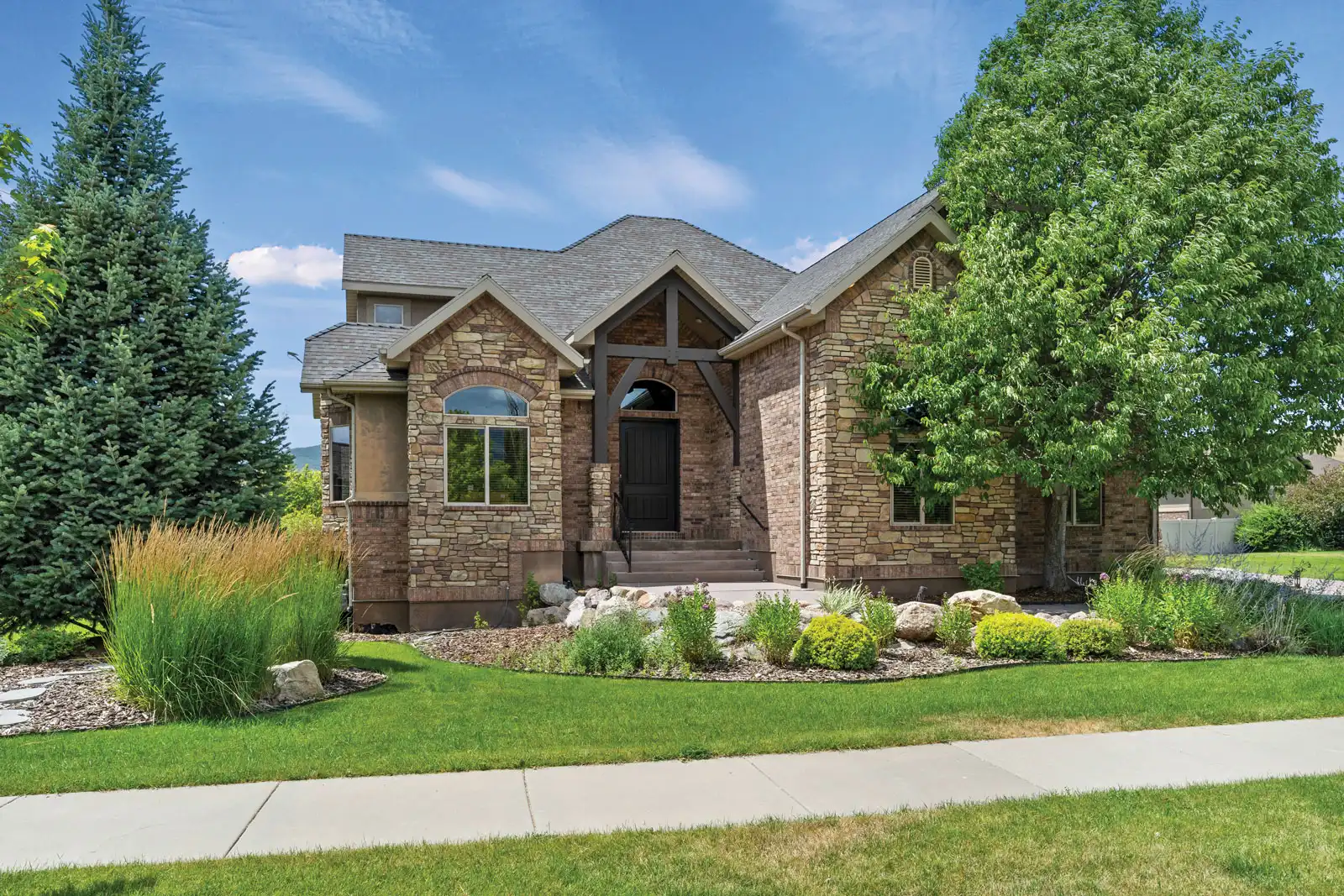 Front entrance of 5997 Roundup Ct in the afternoon with harsh shadows.
