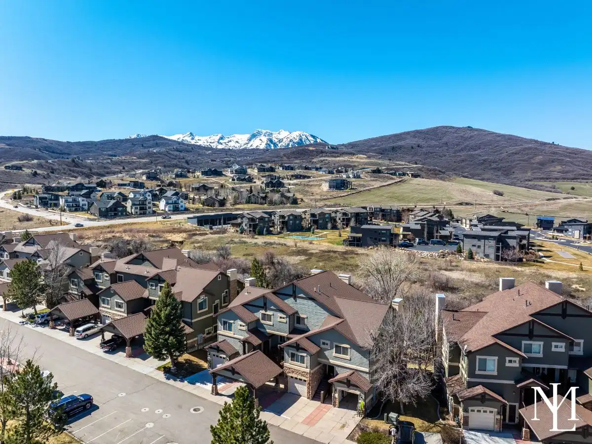 Aerial view of Lakeside Village townhome in Huntsville, Utah with surrounding mountain neighborhood views.