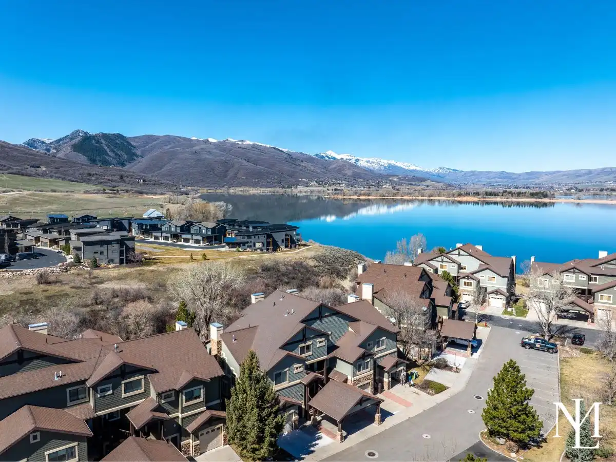 Aerial view of Lakeside Village near Pineview Reservoir with mountain and water views in Ogden Valley.