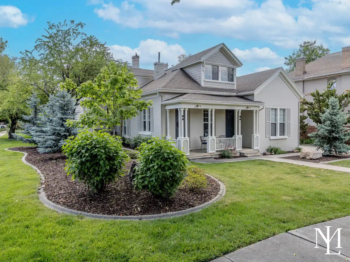 Historic Salt Lake City home at 86 N F St with covered front porch, mature landscaping, and walkable Avenues neighborhood setting