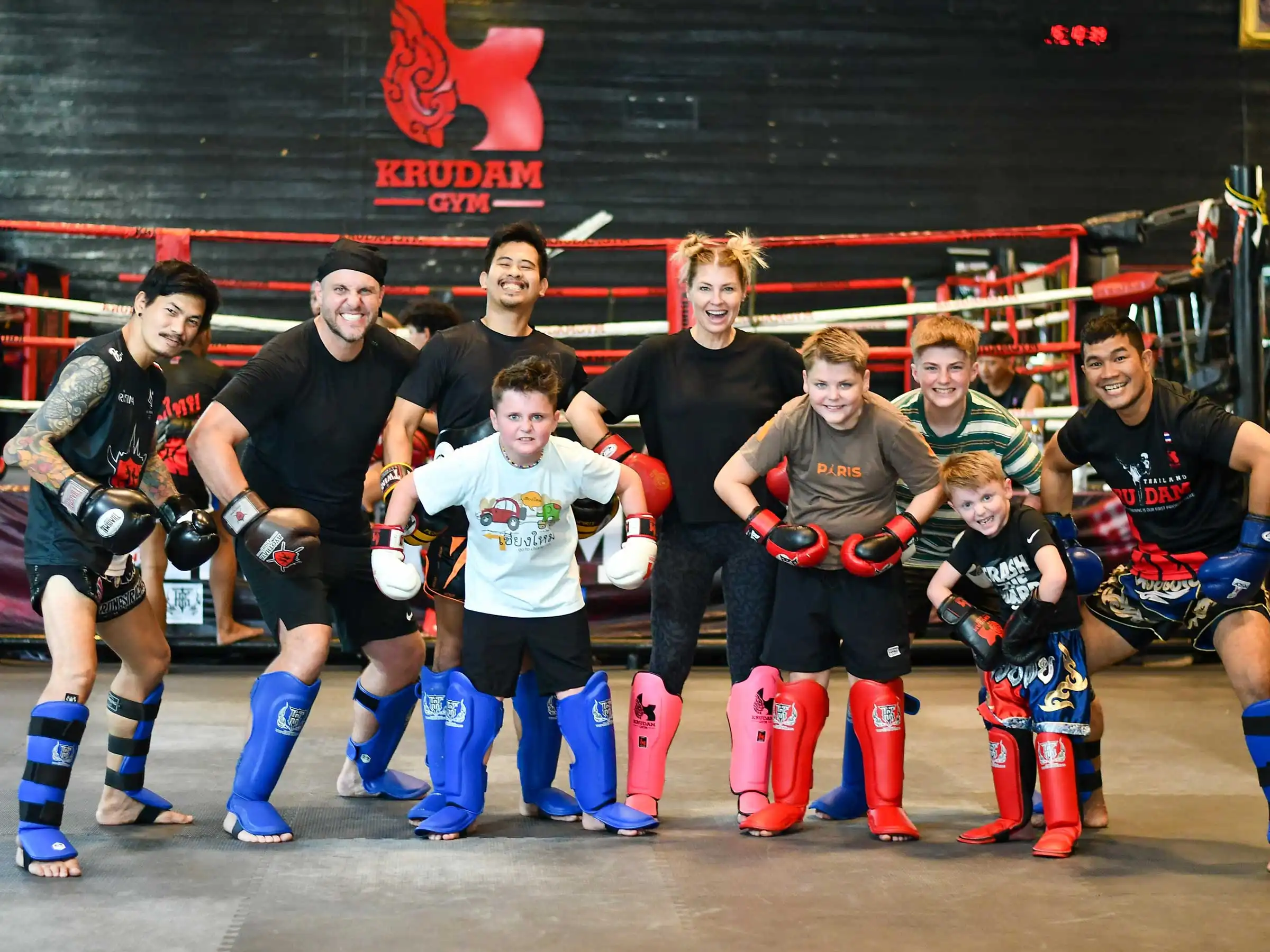 Family learning Thai kick boxing.