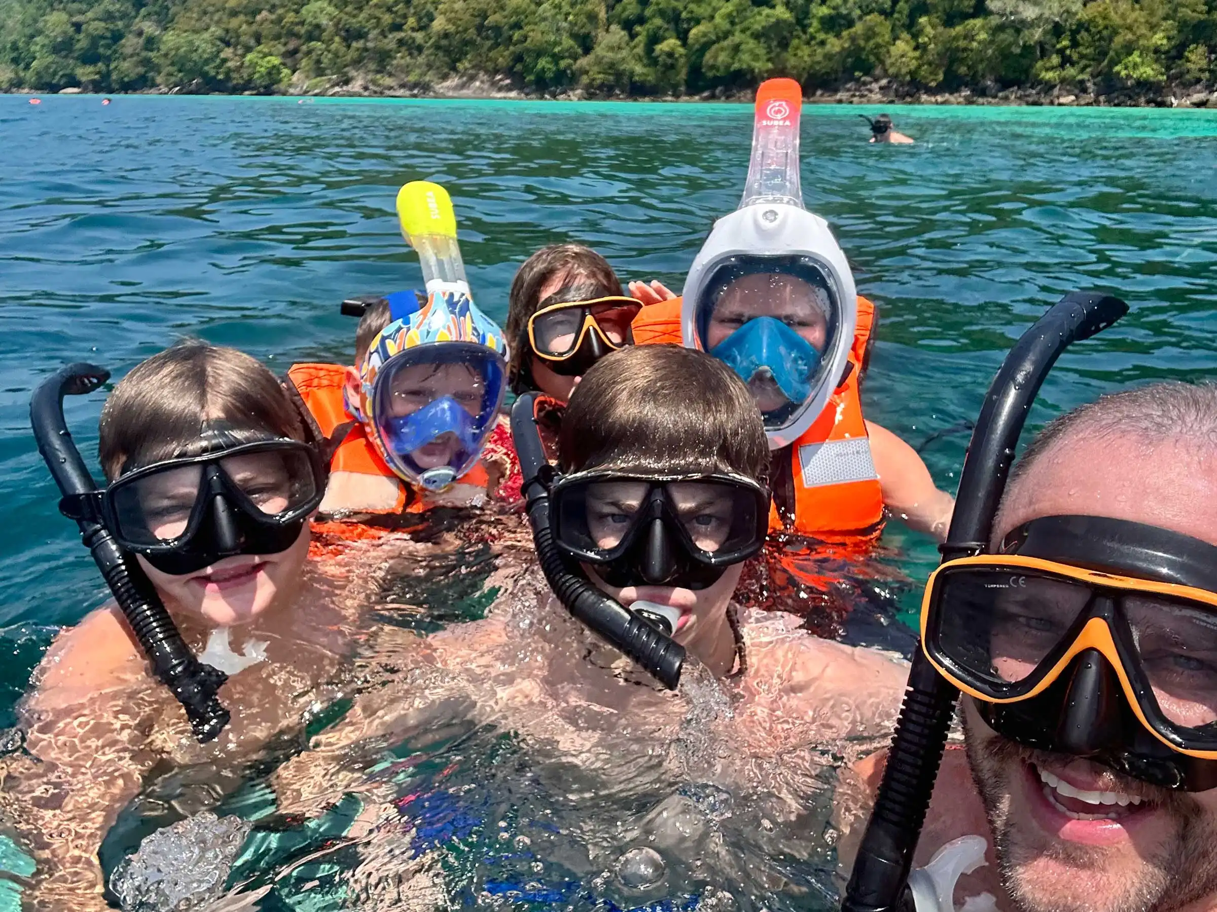 A family snorkeling.