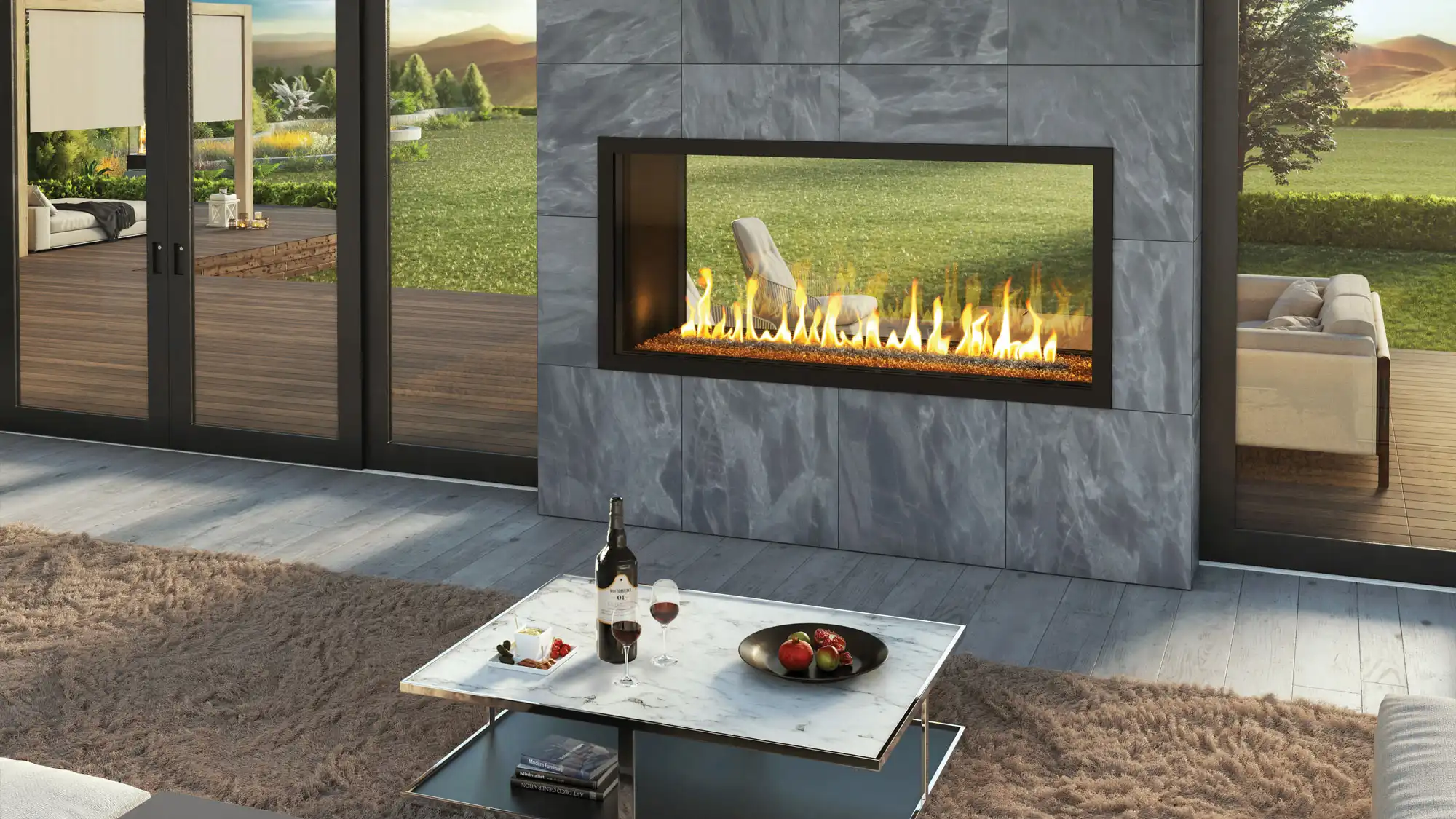 Mock of a fireplace connecting the interior to the exterior with a coffee table holding wine, apples, and books.
