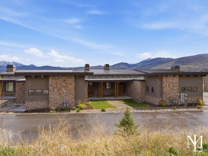 Eden, Utah exterior mountain view townhome with stone facade.