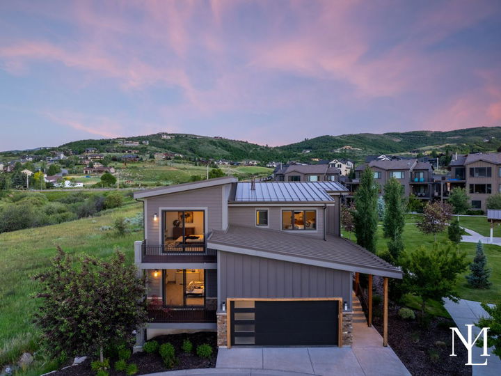 Exterior of a modern Huntsville, UT home in Edgewater with mountain views at sunset.