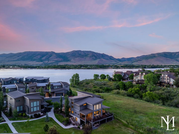 Aerial view of an Edgewater home near Pineview Reservoir with surrounding mountains and open space.