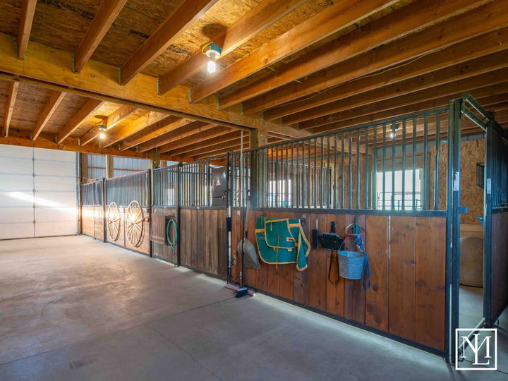 7768 E 1075 N Huntsville, UT Log Home Horse Barn Interior Stalls