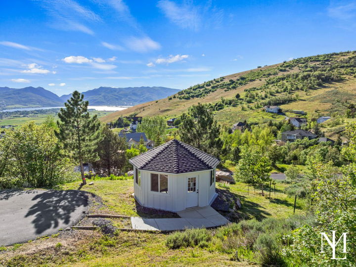 Hillside gazebo with panoramic Ogden Valley, Pineview Reservoir, and mountain views.
