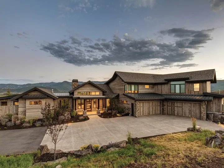 Beautiful custom rustic mountain home at dusk.