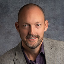 Professional headshot of Jake McEntire, Real Estate Agent
