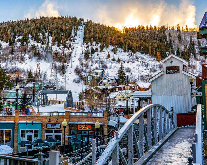 Park City Mountain base area with chairlifts, ski runs, and village buildings in winter.
